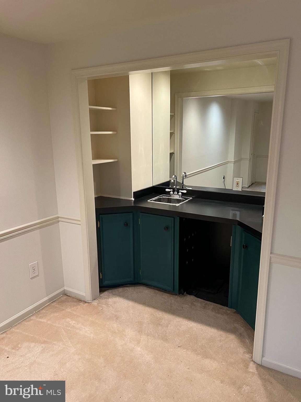 10775 Brewer House Road Rockville, MD 20852 - Photo 15 of 19 a bathroom with a sink and a mirror