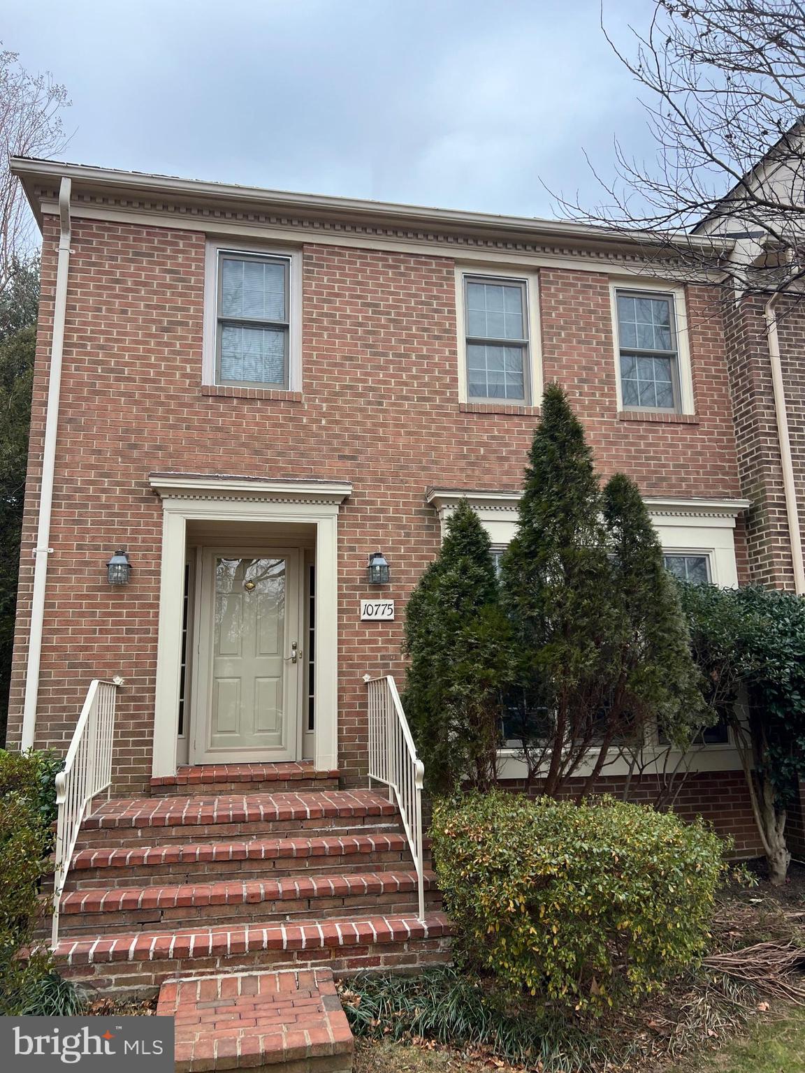 10775 Brewer House Road Rockville, MD 20852 - Photo 2 of 19 a front view of a house with a garden