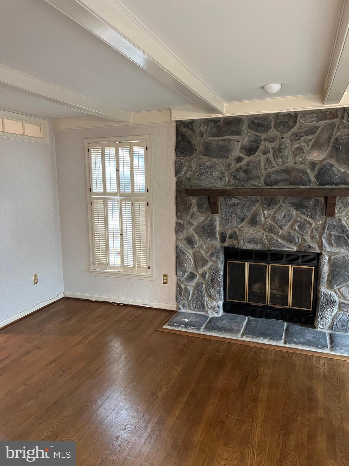 10775 Brewer House Road Rockville, MD 20852 - Photo 4 of 19 a living room with a fireplace in it
