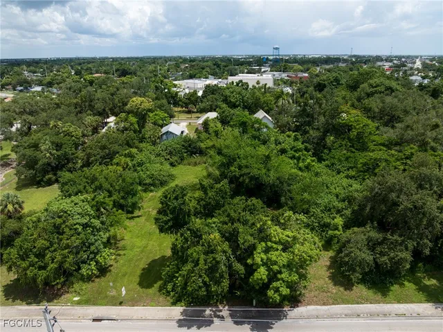 an aerial view of a houses with yard