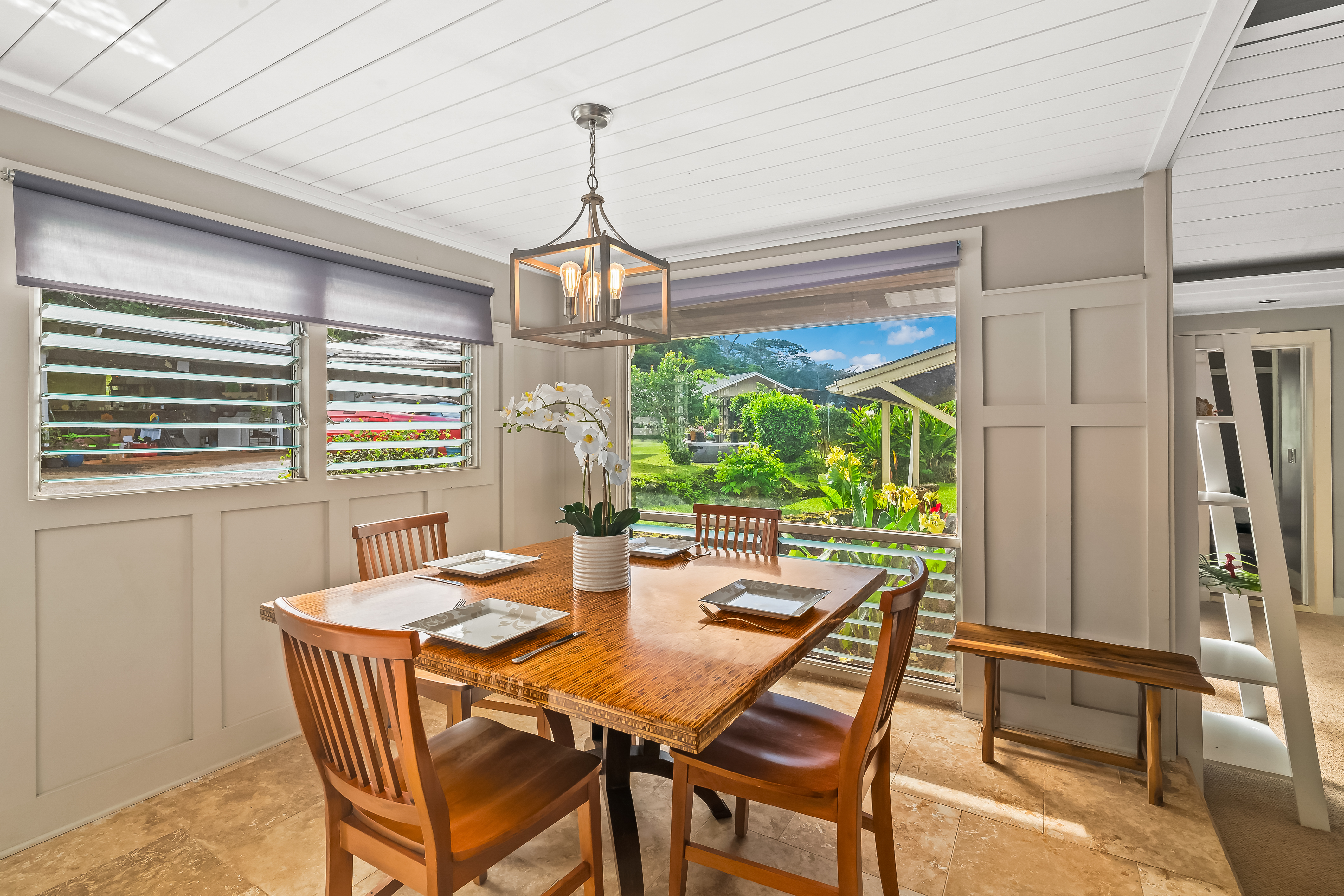 4694 Kua Road Kalaheo, HI 96741 - Photo 3 of 3 a dining room with furniture a chandelier and window