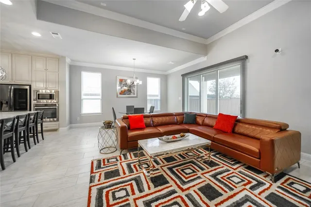 a living room with furniture and a rug