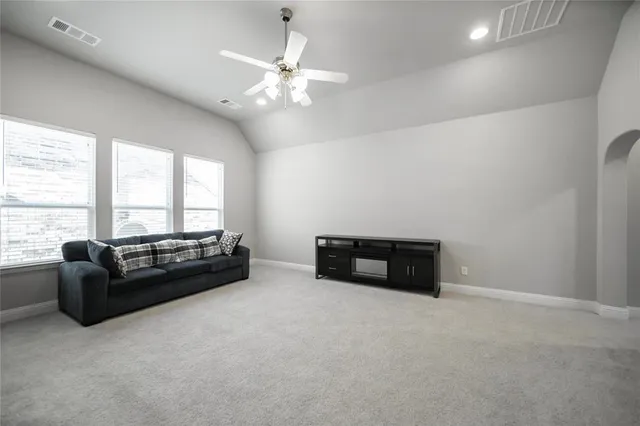 a living room with furniture and a window