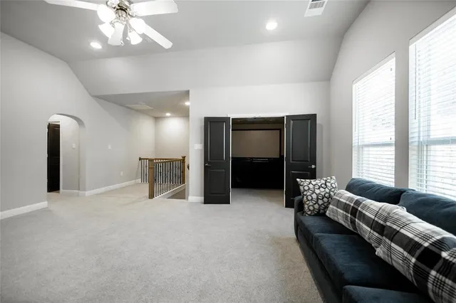 a living room with furniture and window