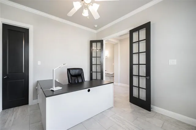 a view of workspace with window and hallway