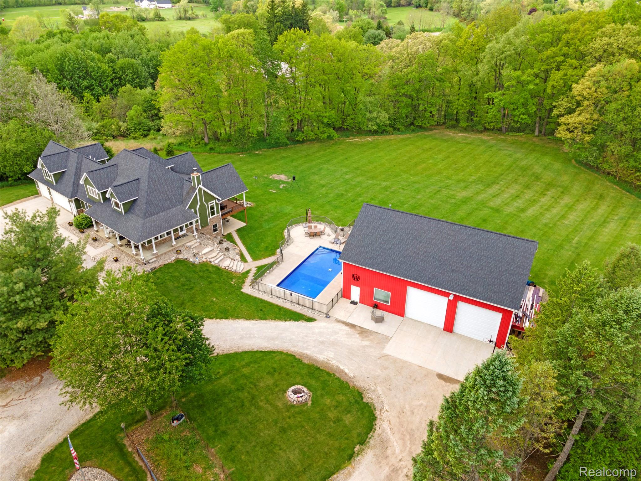 13085 Rohn Road Fenton, MI 48430 - Photo 4 of 52 Aerial view of property and surrounding area featuring a pool area