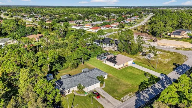 an aerial view of residential houses with outdoor space