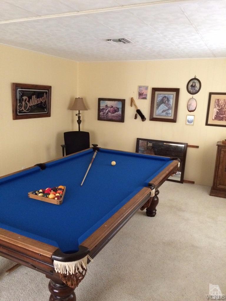 6480 Katherine Road, Unit 83 Simi Valley, CA 93063 - Photo 6 of 9 a room with pool table and a couch