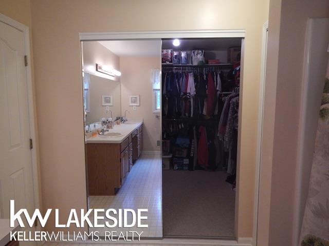 8301 Mist Field Court Howell, MI 48843 - Photo 14 of 34 10x10 Walk-In Closet inside Master Bathroom