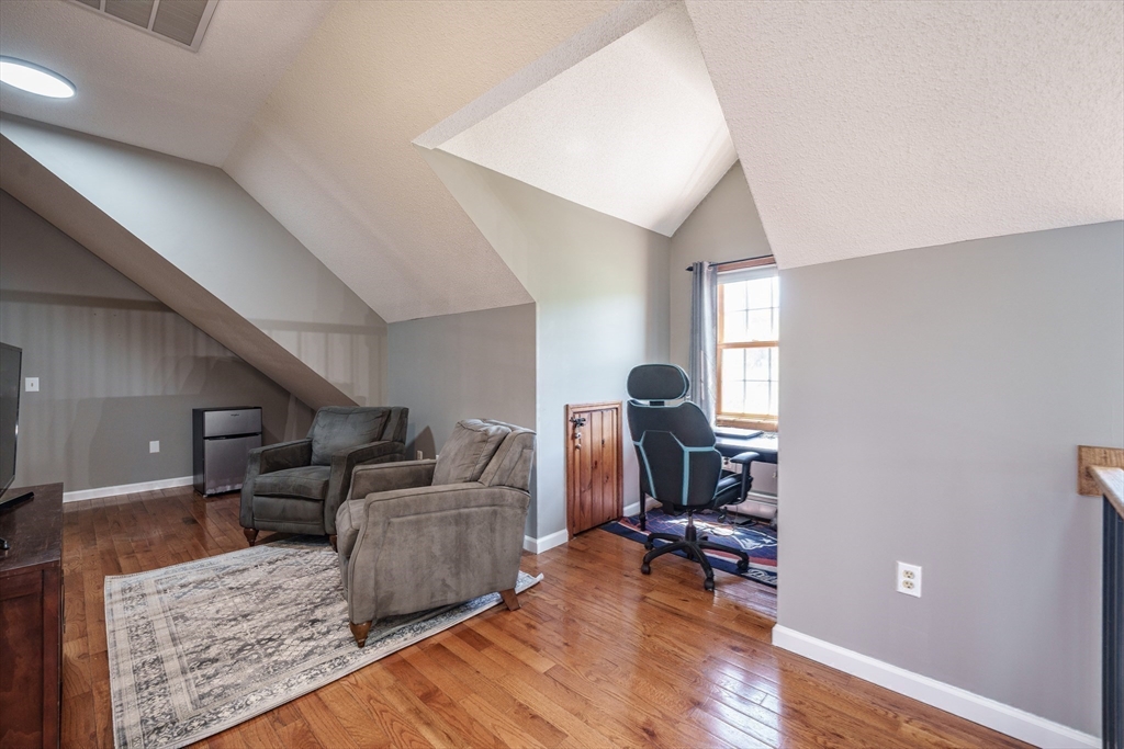 29 Bolles Road Wilbraham, MA 01095 - Photo 18 of 36 a living room with furniture and a wooden floor