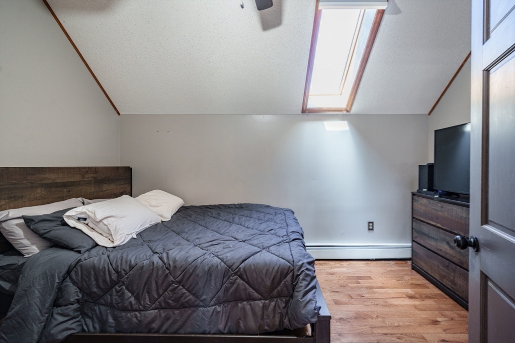 29 Bolles Road Wilbraham, MA 01095 - Photo 19 of 36 a bed sitting in a bedroom next to a window