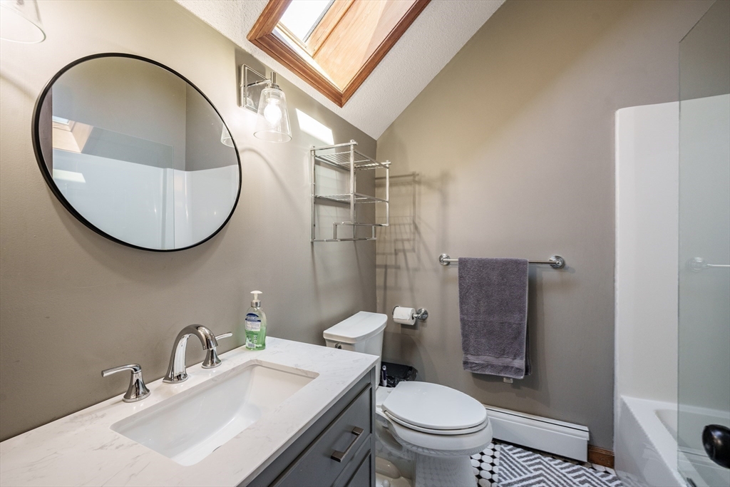 29 Bolles Road Wilbraham, MA 01095 - Photo 20 of 36 a bathroom with a sink a toilet and a mirror