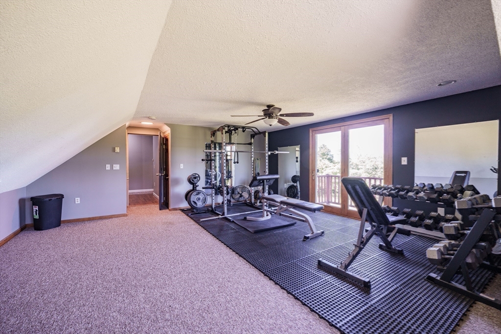 29 Bolles Road Wilbraham, MA 01095 - Photo 21 of 36 a living room with furniture a rug and a large window