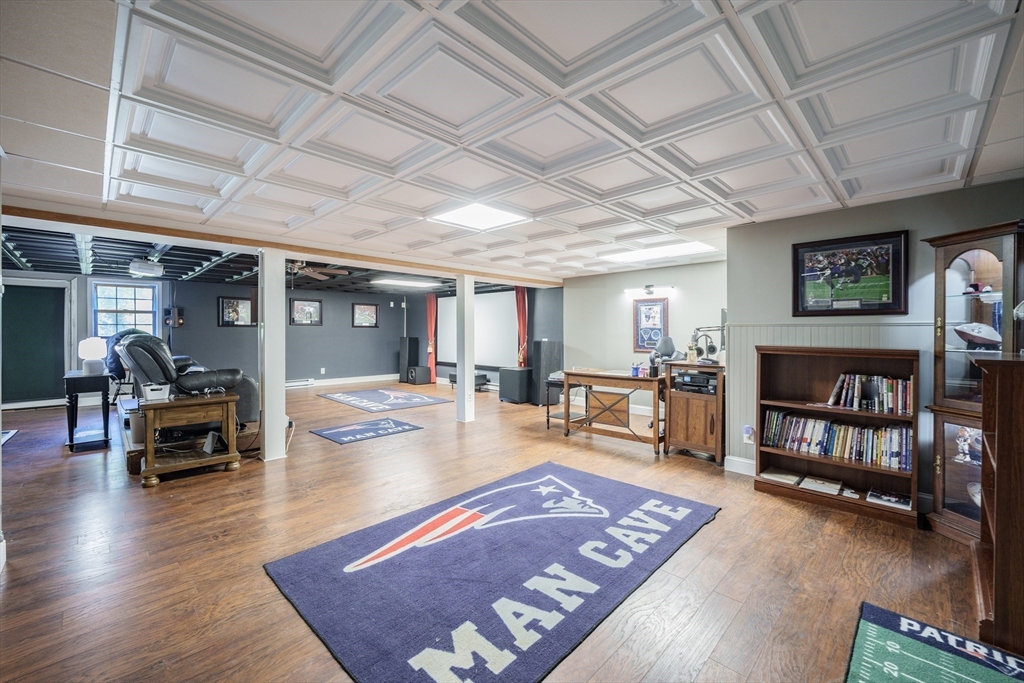 29 Bolles Road Wilbraham, MA 01095 - Photo 22 of 36 a living room with furniture and a book shelf
