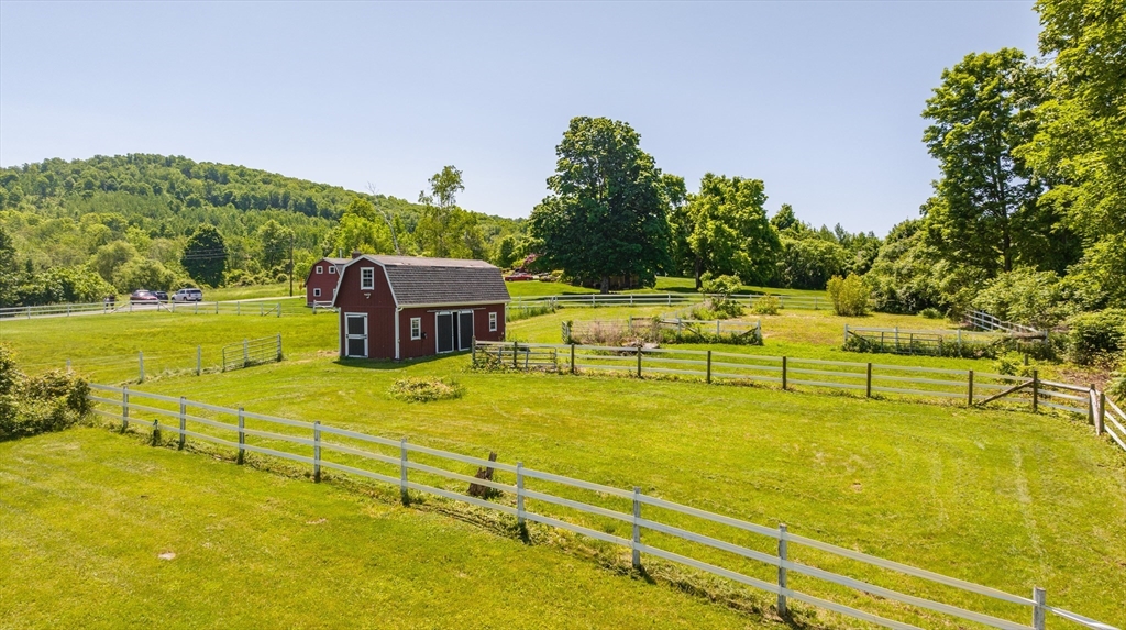 29 Bolles Road Wilbraham, MA 01095 - Photo 3 of 36 a view of a swimming pool with an outdoor seating and a yard