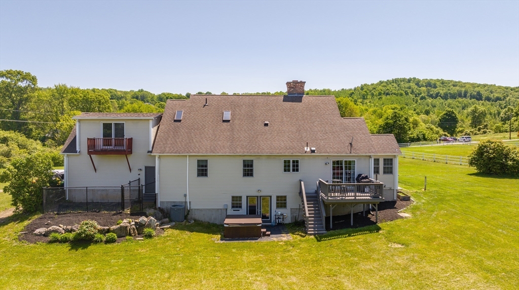 29 Bolles Road Wilbraham, MA 01095 - Photo 34 of 36 a aerial view of a house with swimming pool and a yard