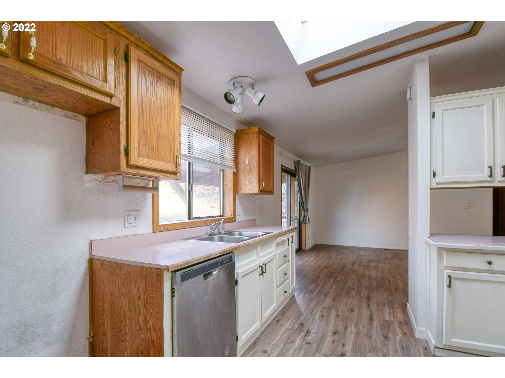 809 Southwest 11th Street Pendleton, OR 97801 - Photo 14 of 32 a kitchen with a sink cabinets and a window