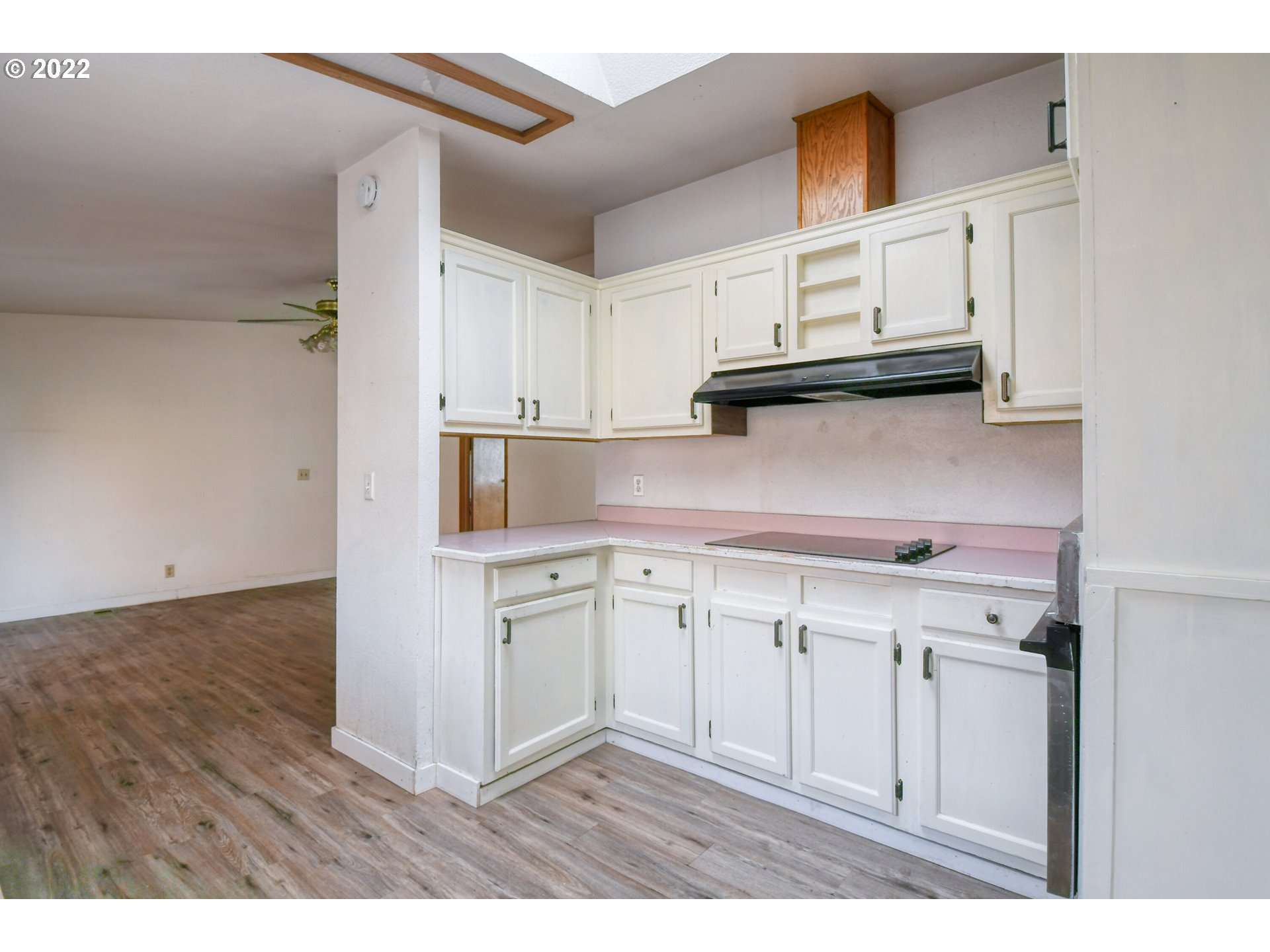 809 Southwest 11th Street Pendleton, OR 97801 - Photo 15 of 32 a kitchen with cabinets and a wooden floor