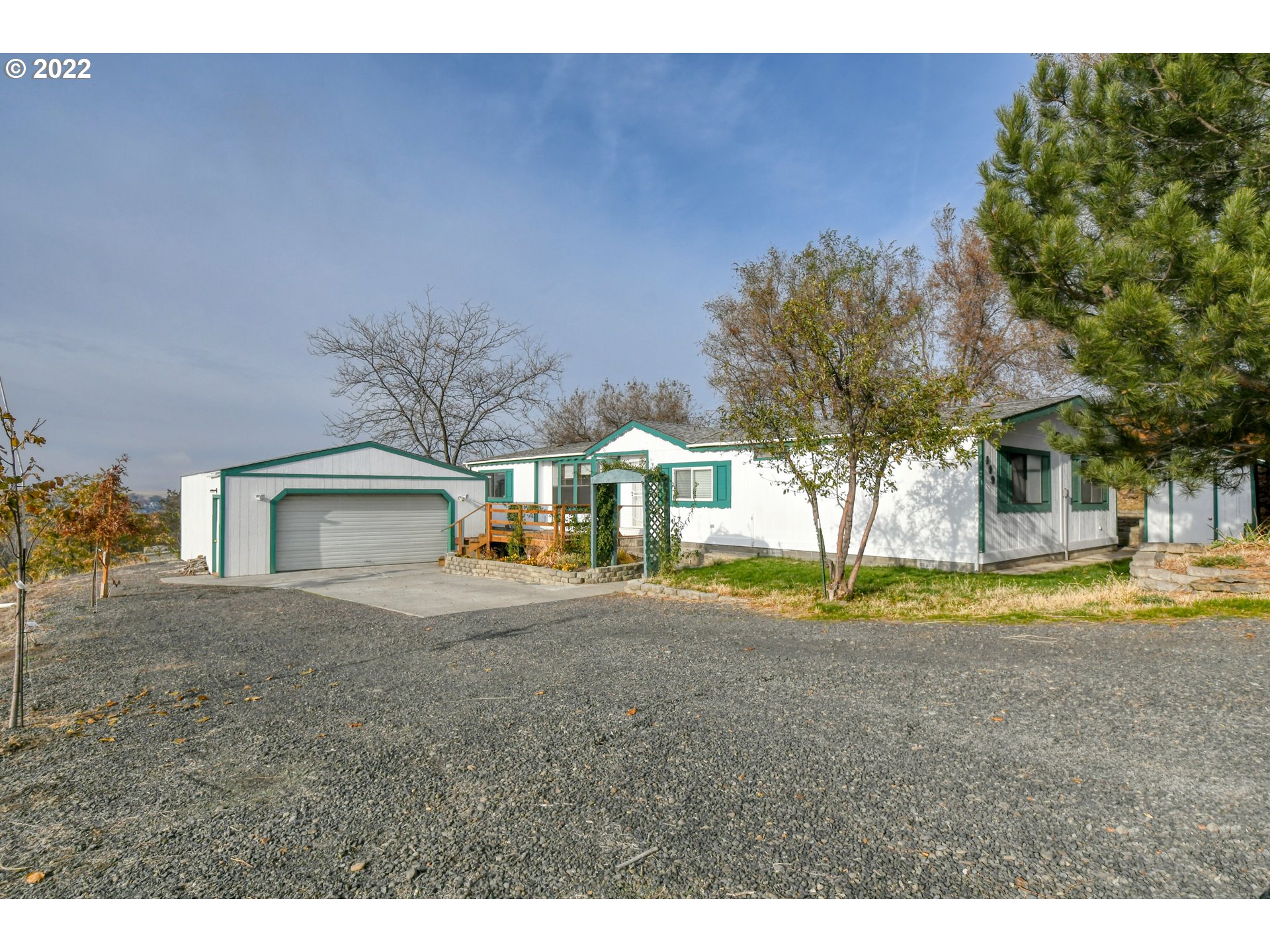 809 Southwest 11th Street Pendleton, OR 97801 - Photo 2 of 32 a view of a house with a yard and large trees