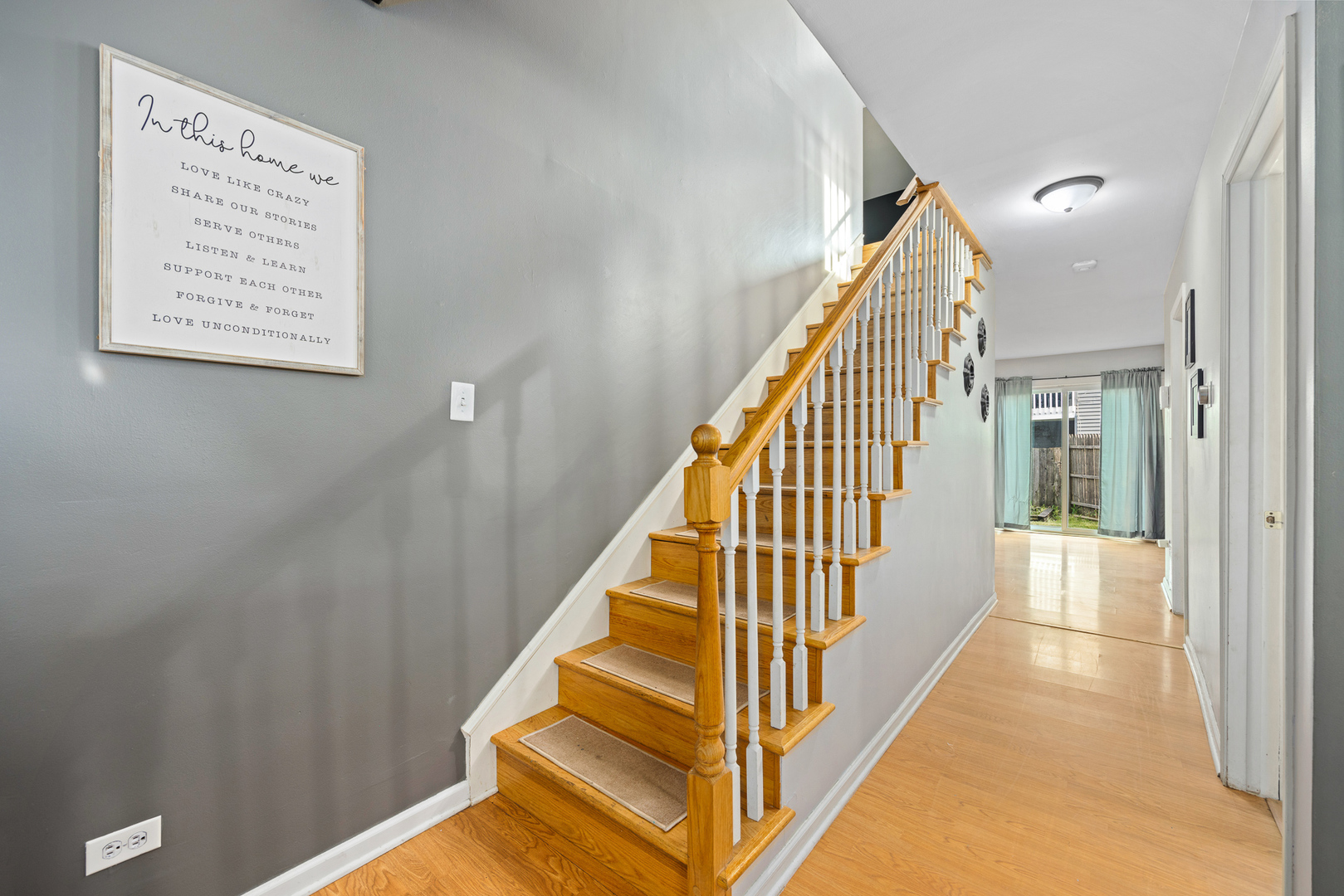 302 Thistle Drive Bolingbrook, IL 60490 - Photo 12 of 33 a view of staircase with wooden floor and white walls