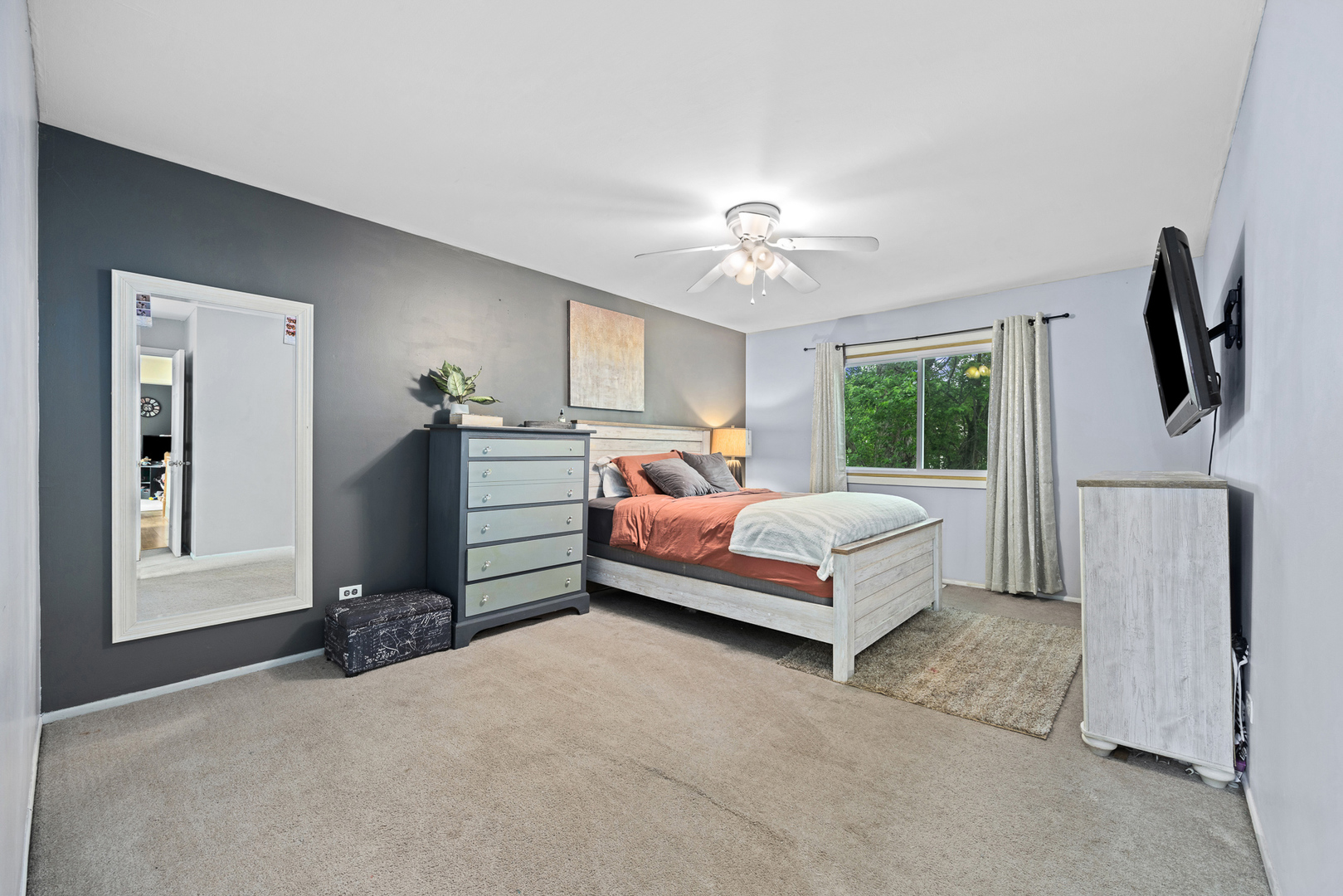 302 Thistle Drive Bolingbrook, IL 60490 - Photo 16 of 33 a spacious bedroom with a bed and a chandelier