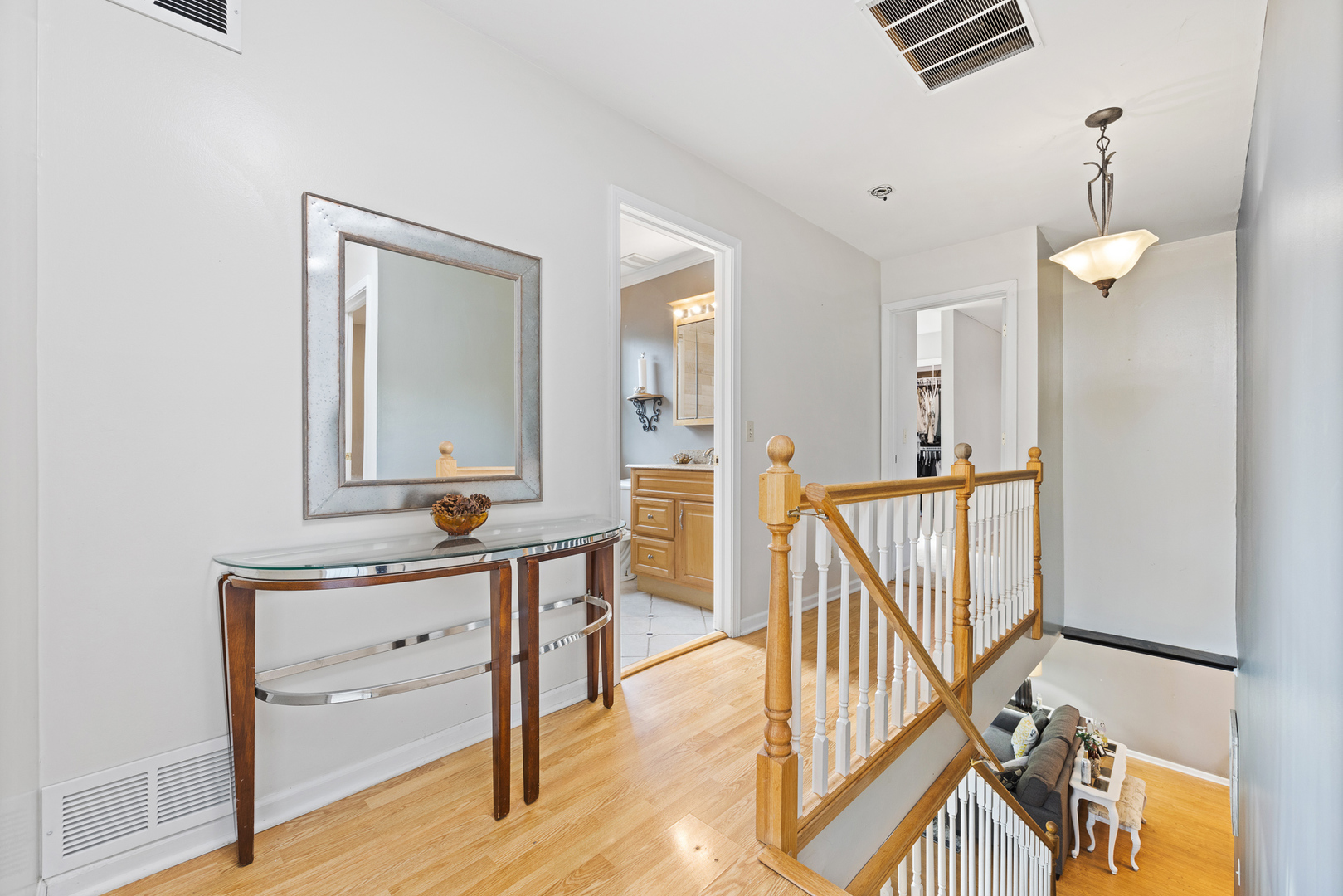 302 Thistle Drive Bolingbrook, IL 60490 - Photo 18 of 33 a view of a hallway with wooden floor and staircase