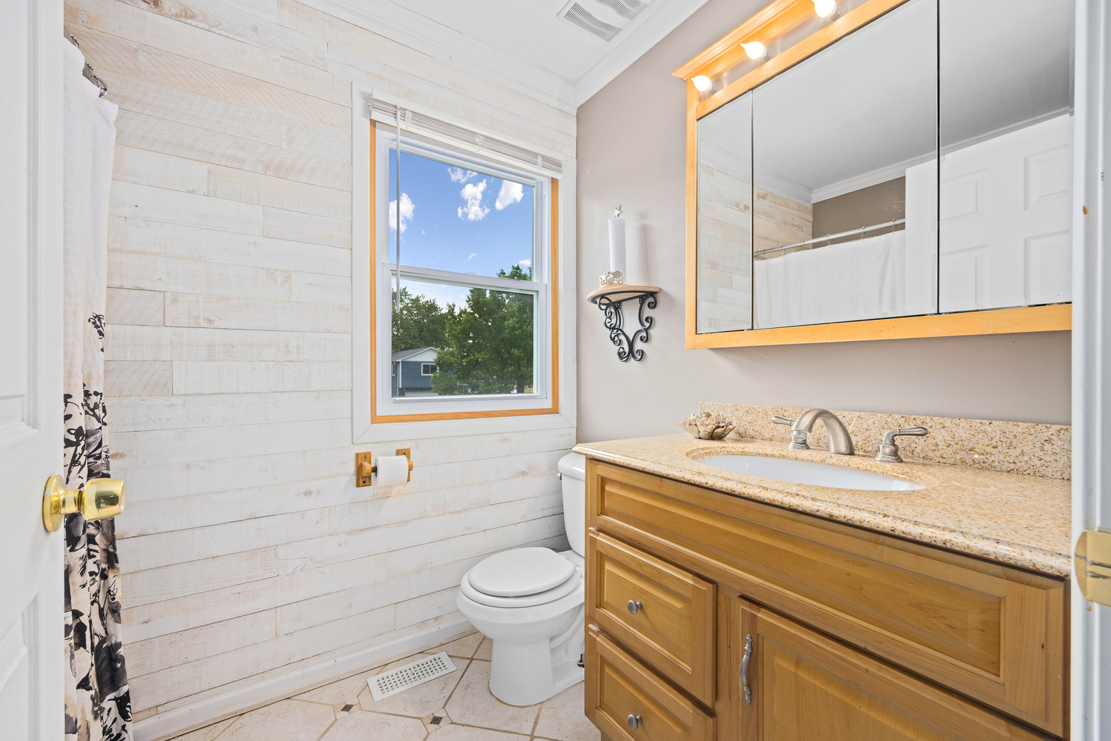 302 Thistle Drive Bolingbrook, IL 60490 - Photo 19 of 33 a bathroom with a granite countertop toilet sink and mirror