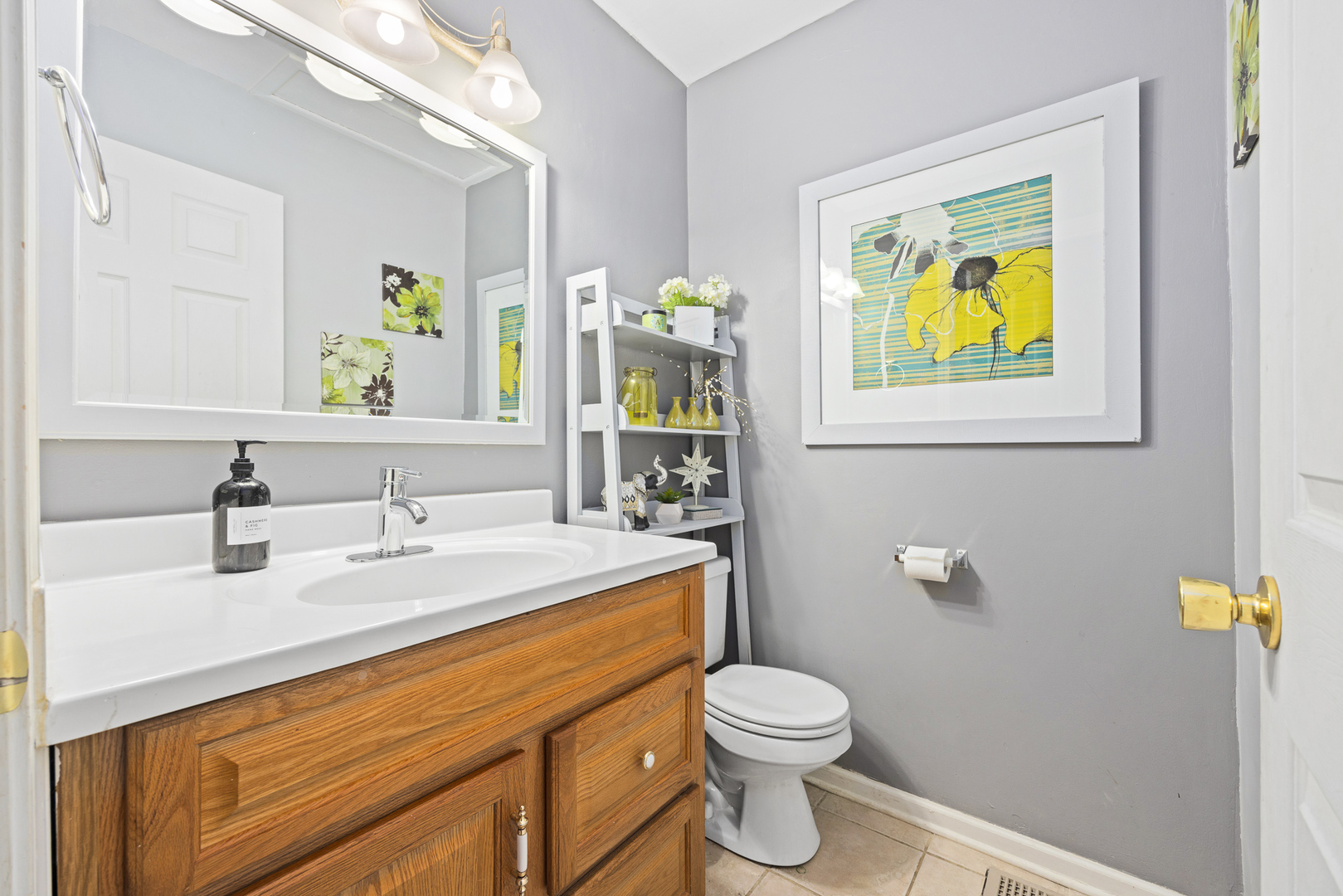 302 Thistle Drive Bolingbrook, IL 60490 - Photo 21 of 33 a bathroom with a granite countertop toilet sink and mirror