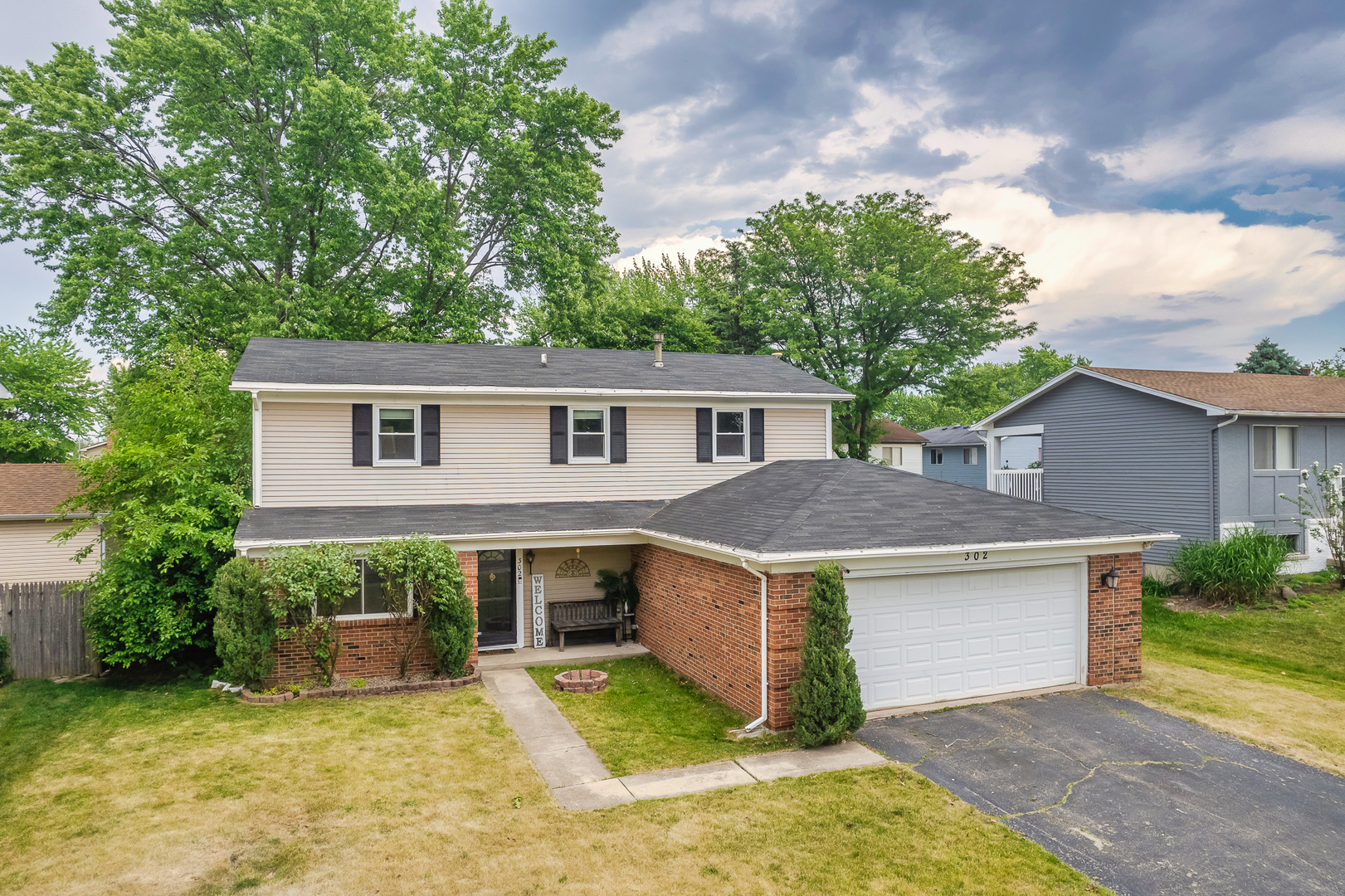 302 Thistle Drive Bolingbrook, IL 60490 - Photo 23 of 33 a view of a house with pool and a yard
