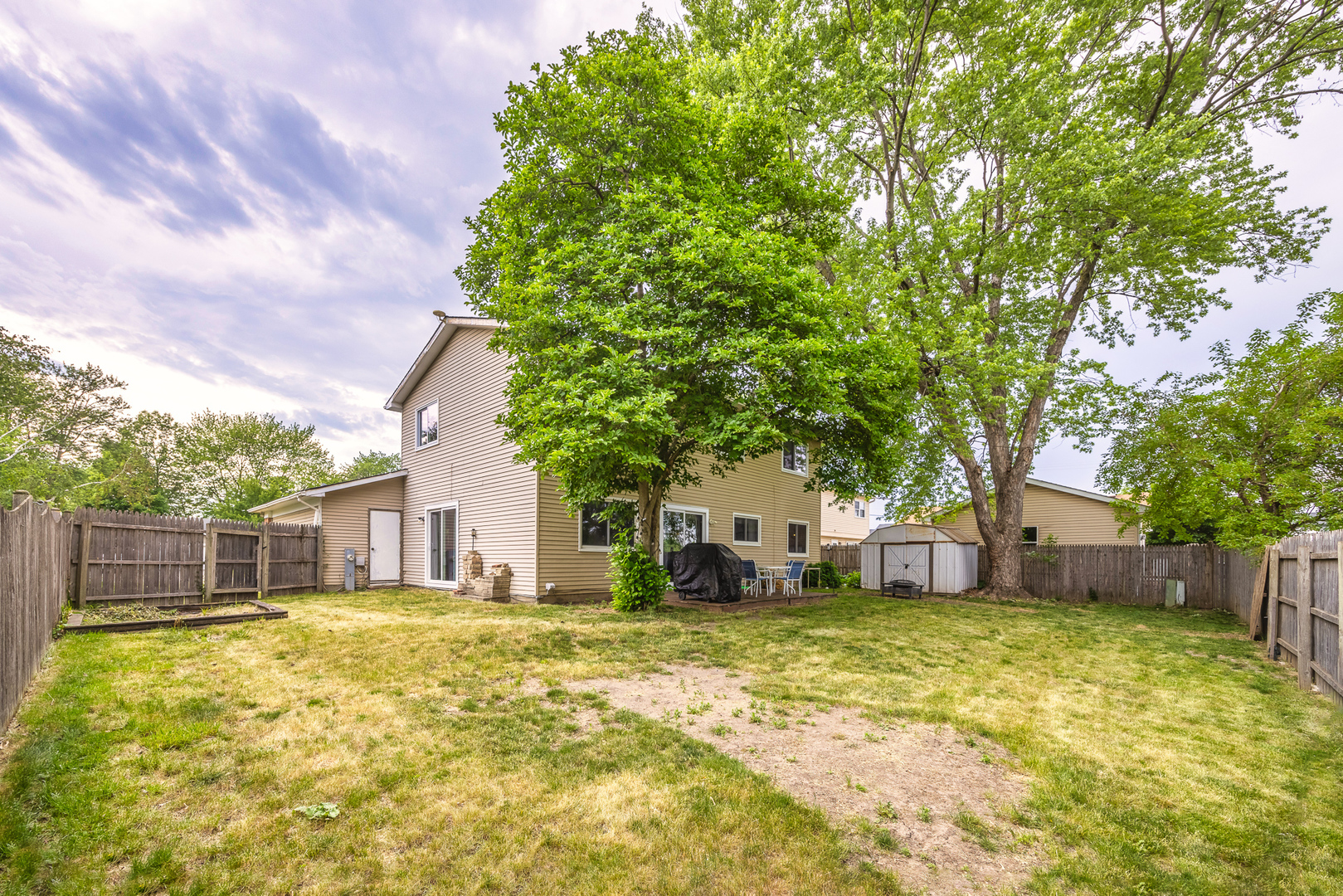302 Thistle Drive Bolingbrook, IL 60490 - Photo 25 of 33 a view of a house with a backyard