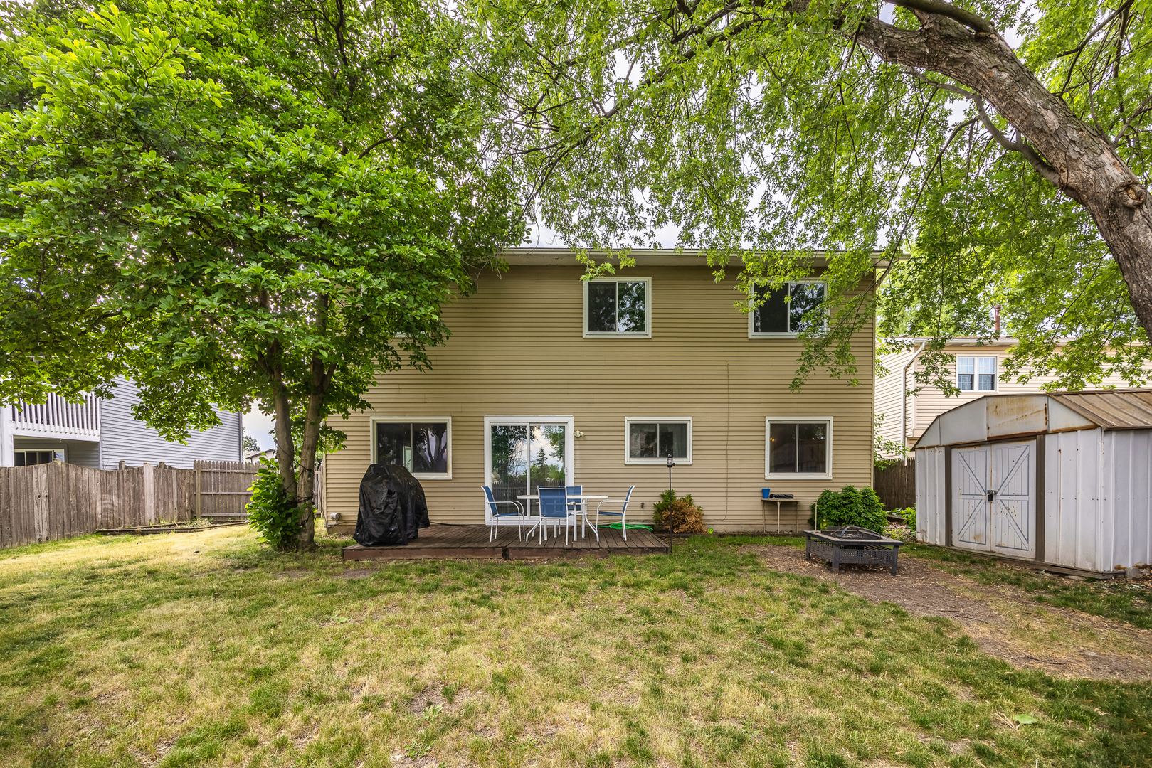 302 Thistle Drive Bolingbrook, IL 60490 - Photo 26 of 33 a backyard of a house with table and chairs