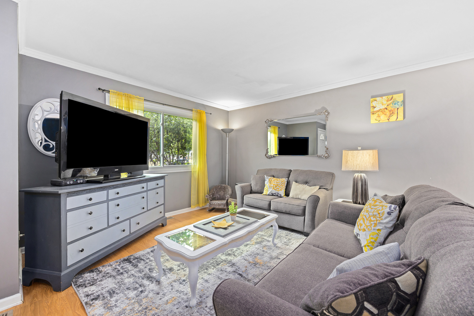 302 Thistle Drive Bolingbrook, IL 60490 - Photo 3 of 33 a living room with furniture and a flat screen tv