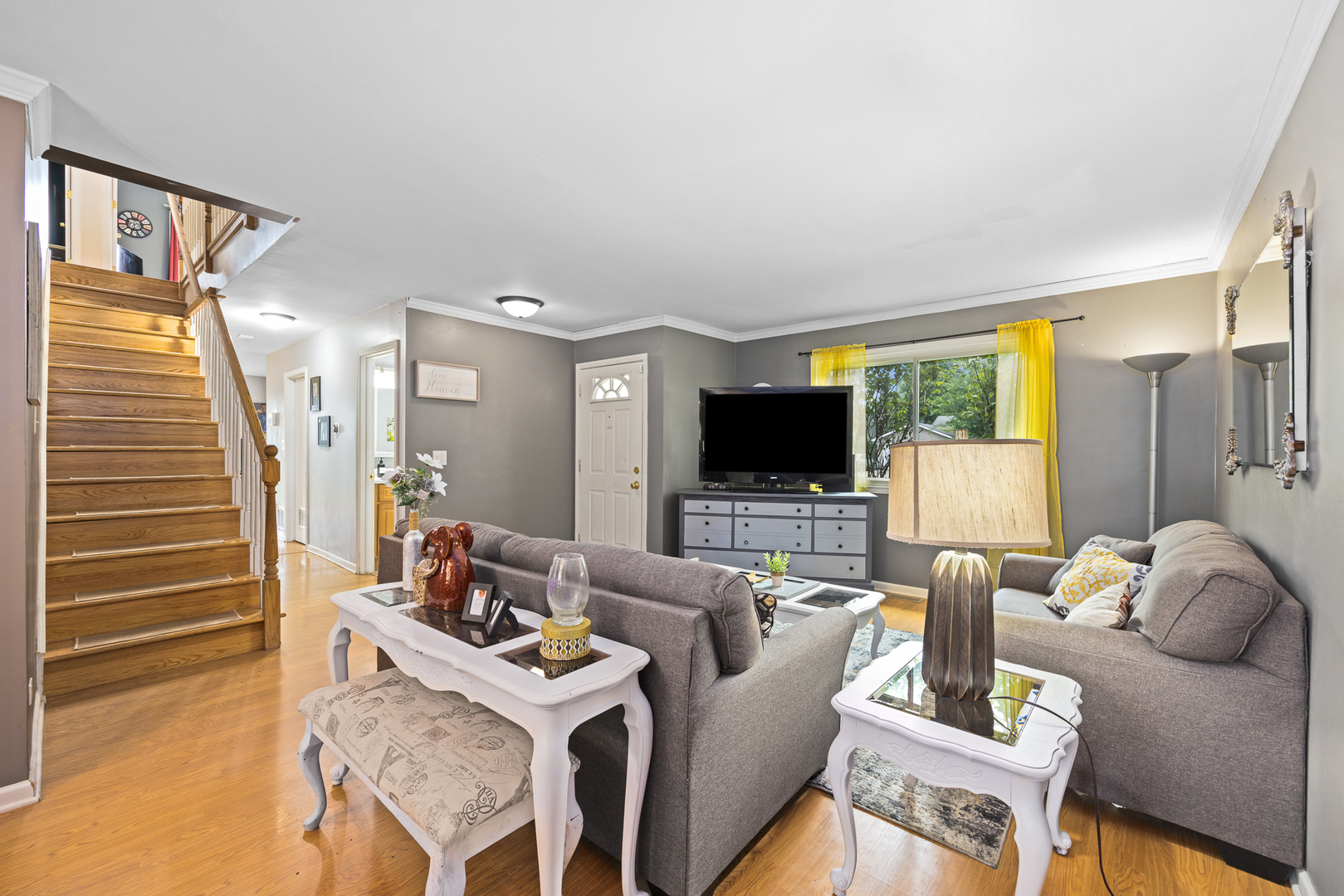 302 Thistle Drive Bolingbrook, IL 60490 - Photo 4 of 33 a living room with furniture and a flat screen tv