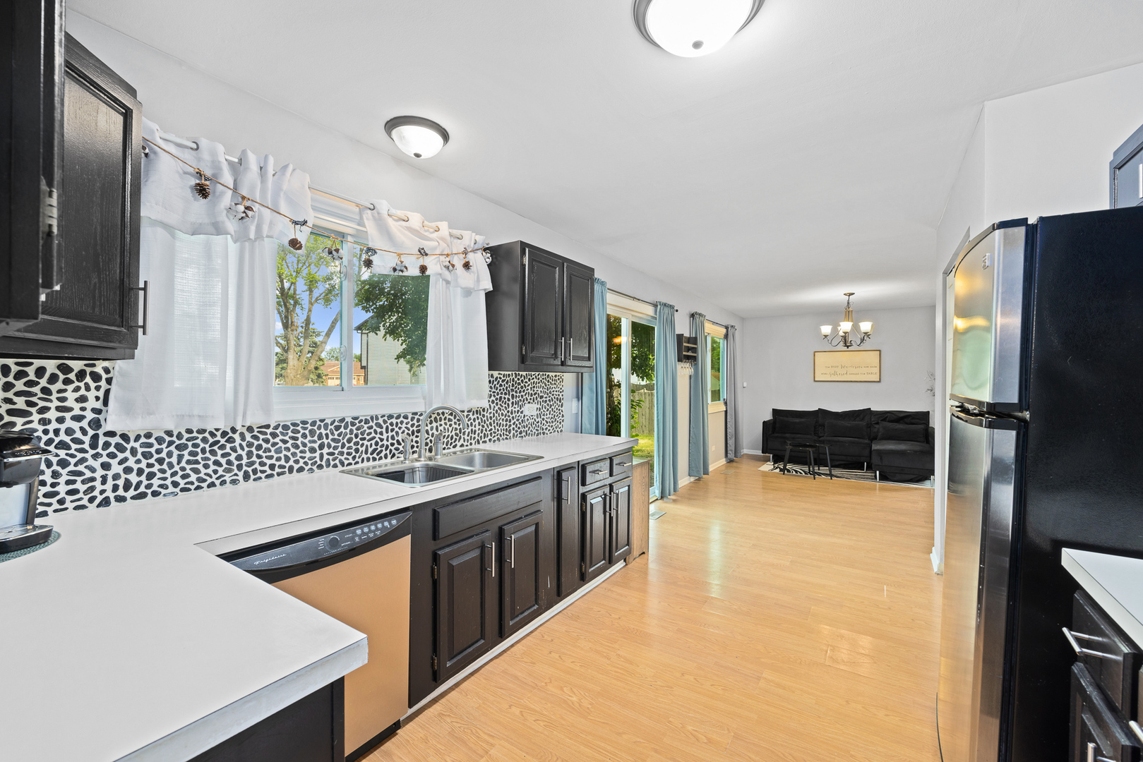 302 Thistle Drive Bolingbrook, IL 60490 - Photo 6 of 33 a kitchen with stainless steel appliances granite countertop a sink stove and refrigerator