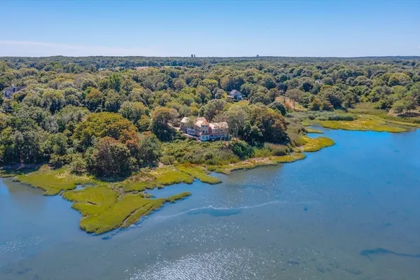 an aerial view of a house with a swimming pool
