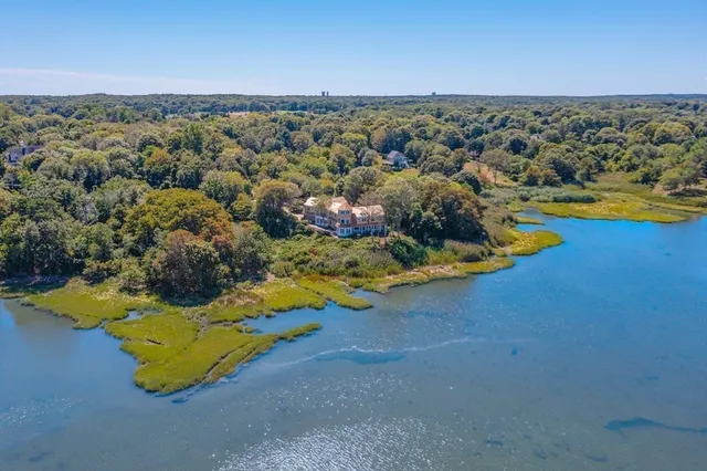 an aerial view of a house with a swimming pool