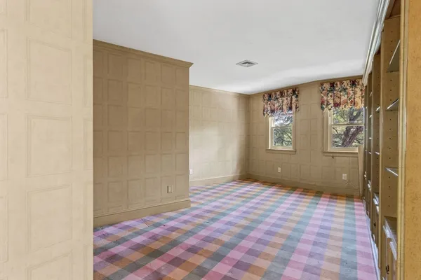 a view of an empty room and window