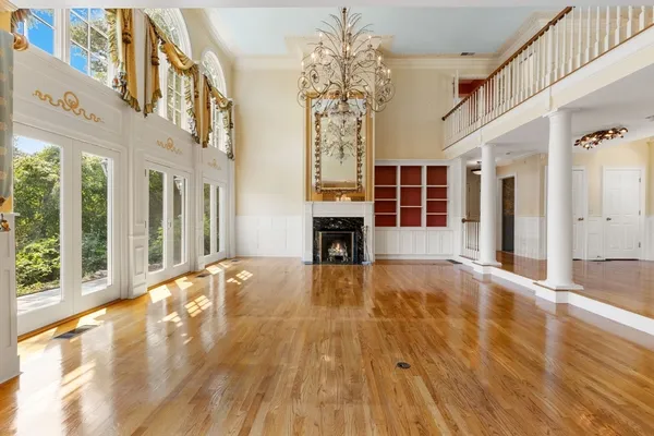 a view of an entryway with wooden floor