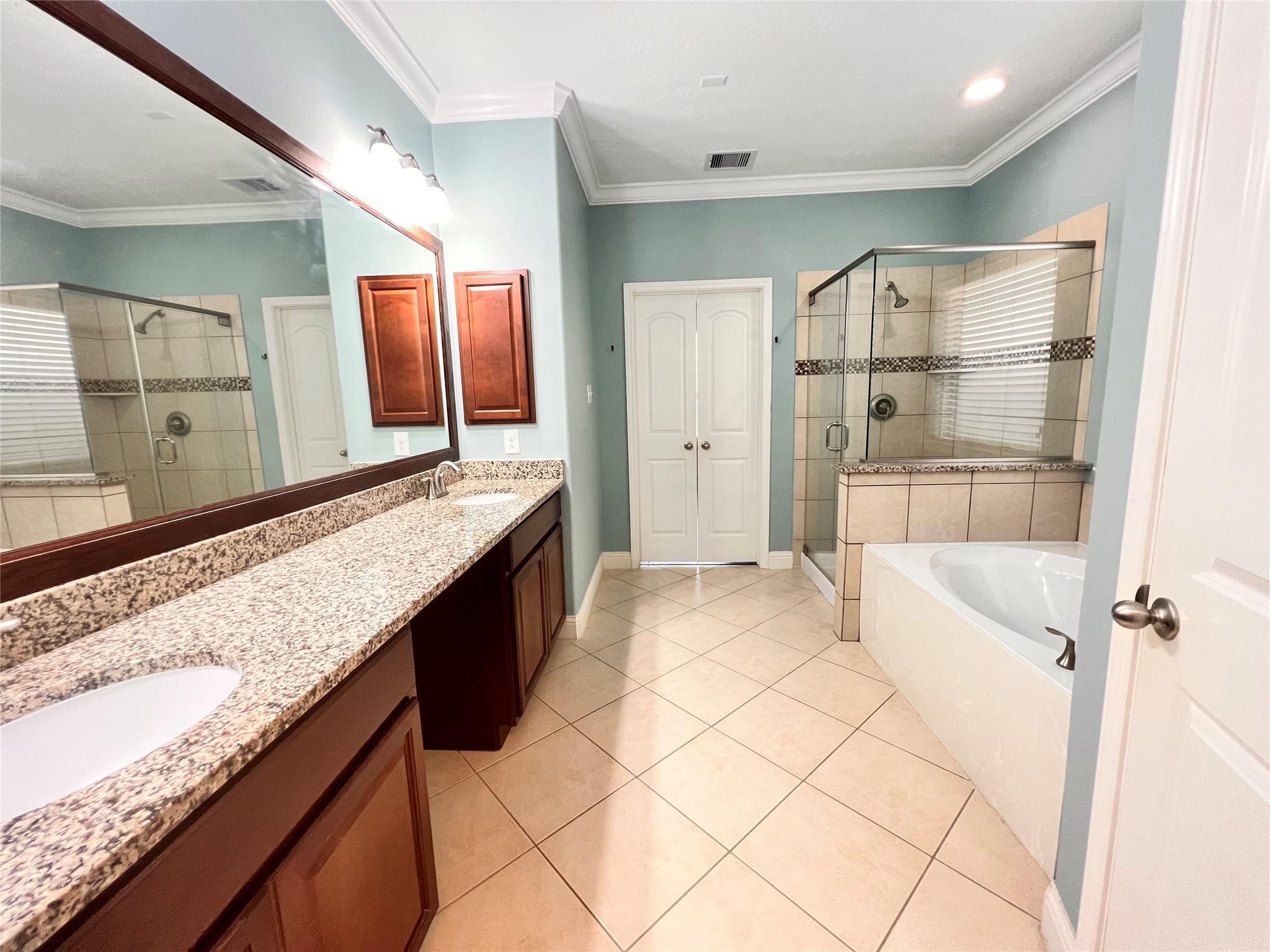 26842 Trinity Trail Cypress, TX 77433 - Photo 13 of 31 a bathroom with a granite countertop sink a mirror and shower