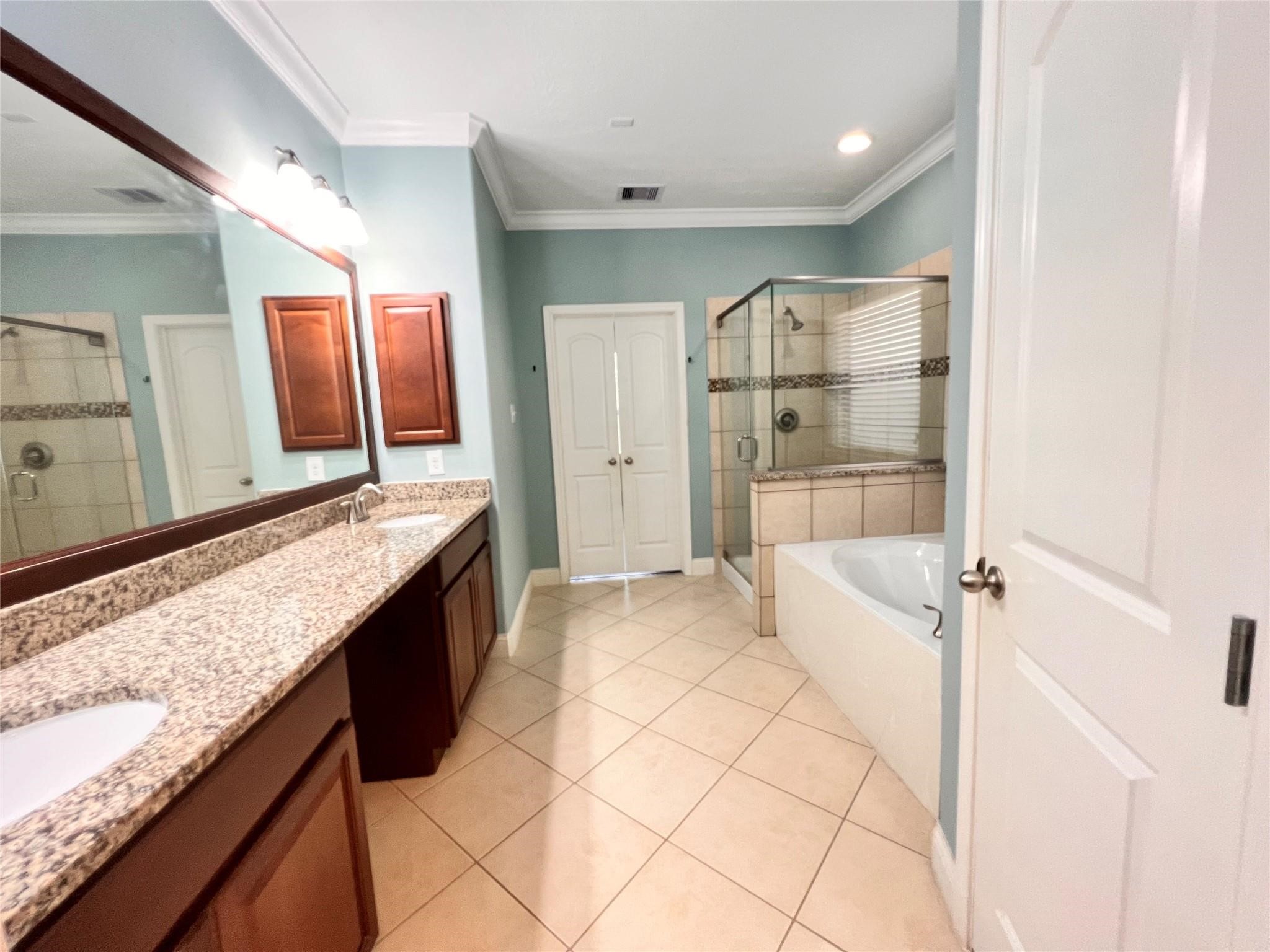 26842 Trinity Trail Cypress, TX 77433 - Photo 14 of 31 a bathroom with a granite countertop sink mirror and shower