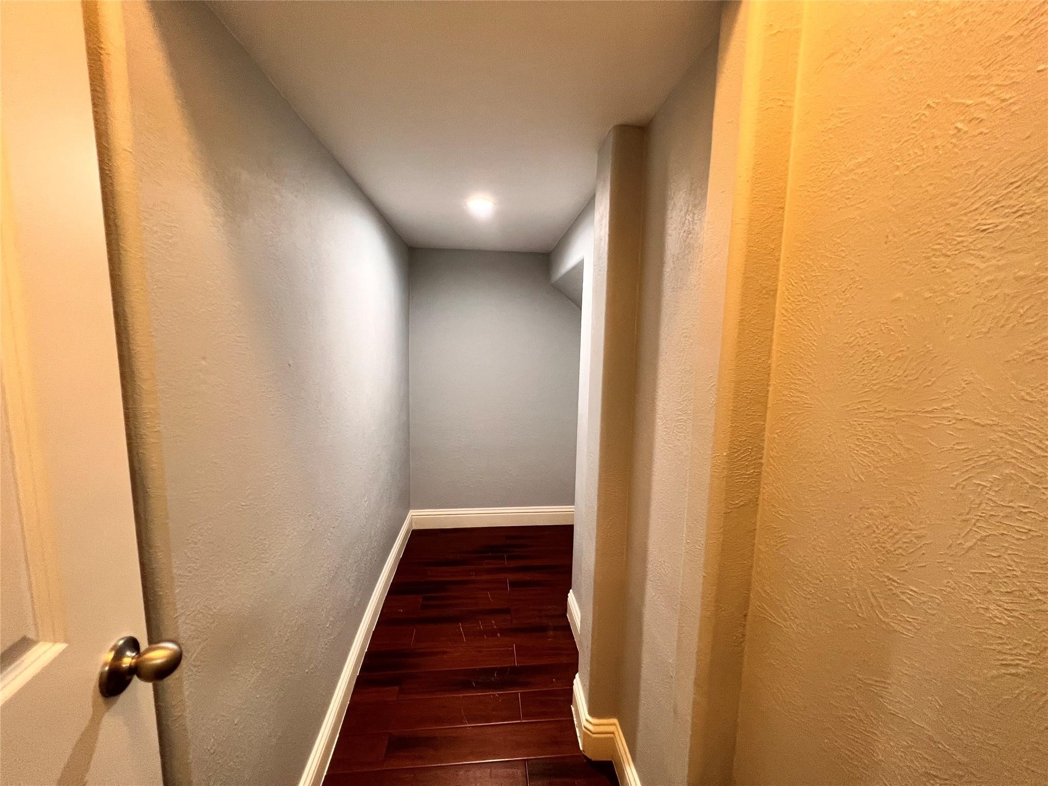 26842 Trinity Trail Cypress, TX 77433 - Photo 20 of 31 a view of a hallway with wooden floor