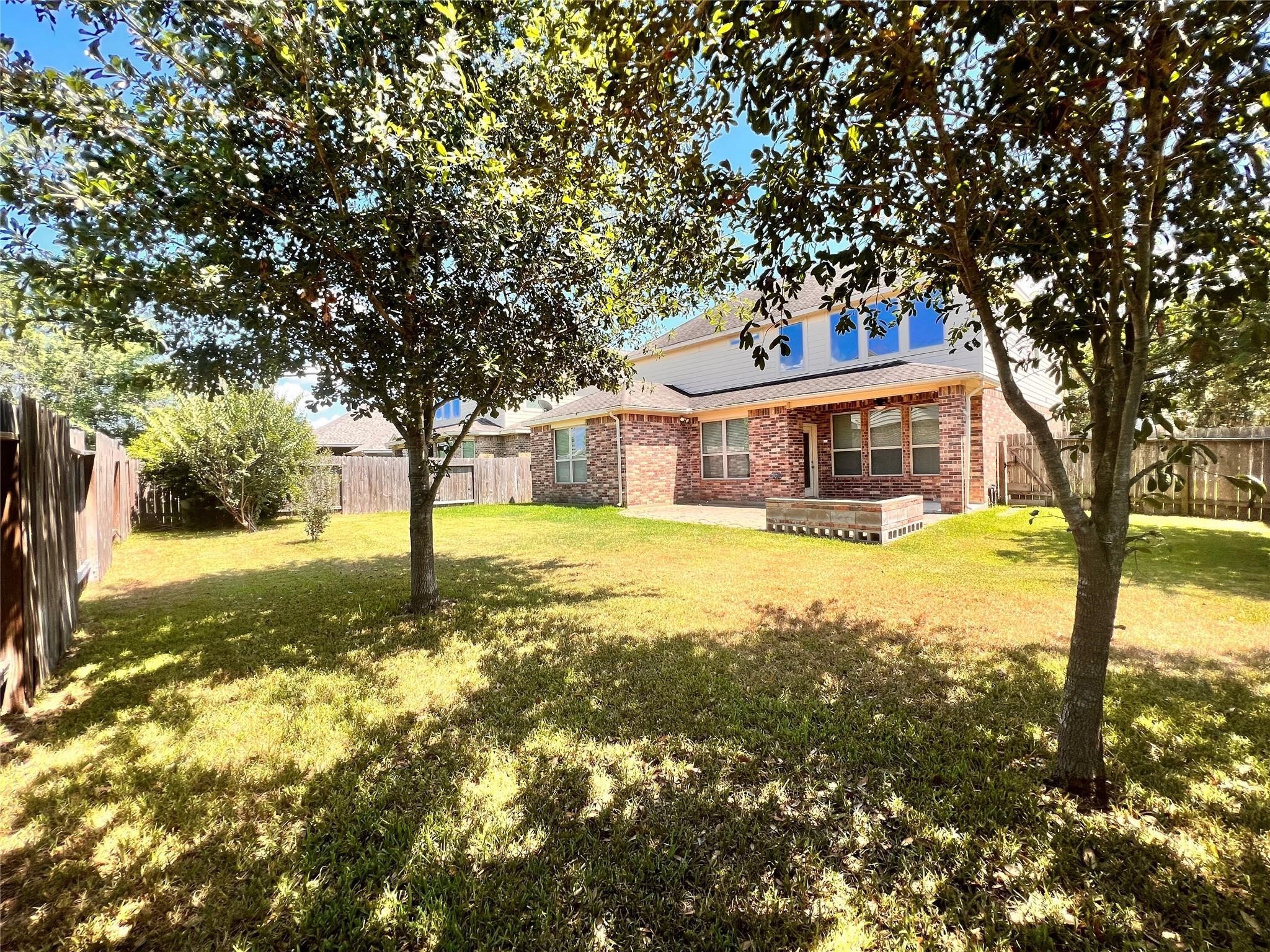 26842 Trinity Trail Cypress, TX 77433 - Photo 30 of 31 a house with swimming pool in front of it