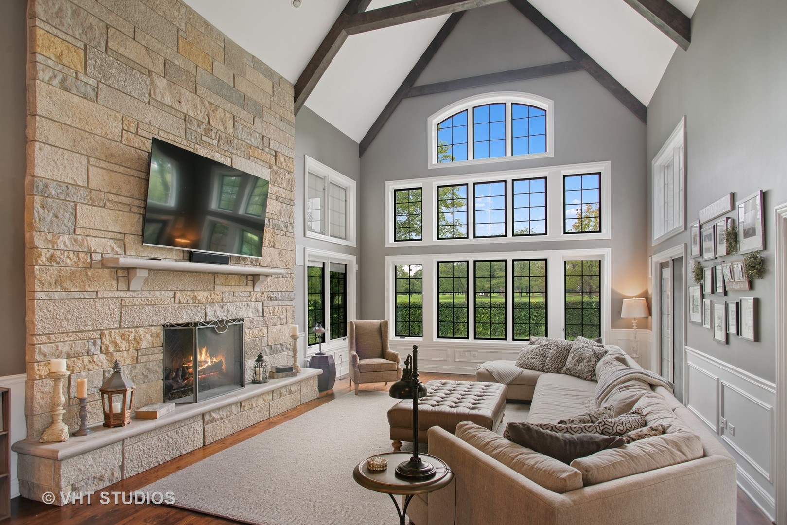 726 Hastings Street Park Ridge, IL 60068 - Photo 12 of 38 a living room with furniture a fireplace and a flat screen tv