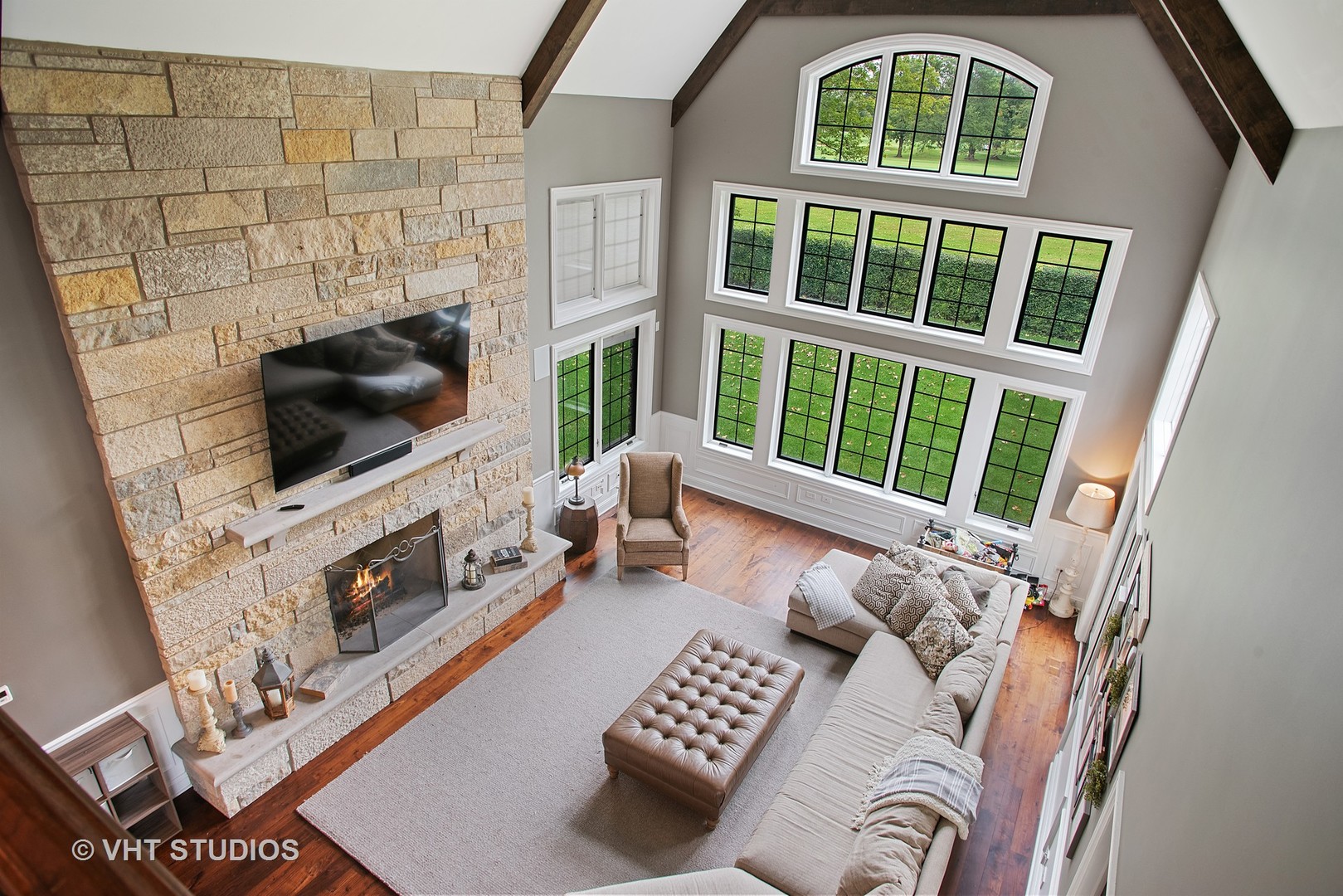 726 Hastings Street Park Ridge, IL 60068 - Photo 14 of 38 a living room with furniture a flat screen tv and a floor to ceiling window
