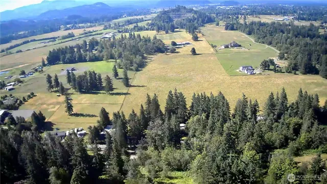 a view of a house with outdoor space and lake view