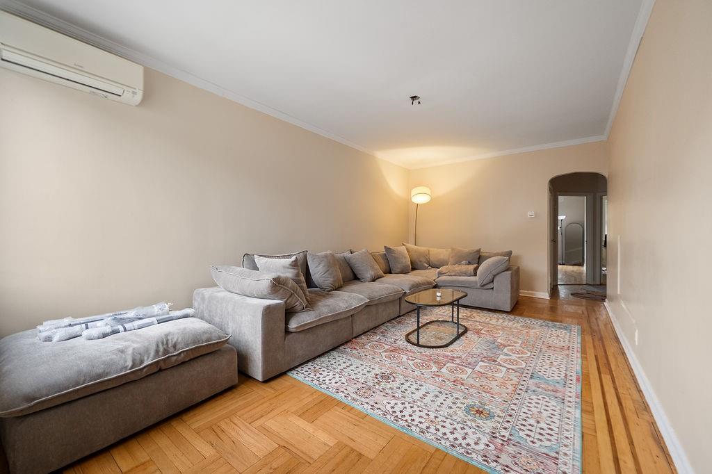 38 Corbin Place Brooklyn, NY 11235 - Photo 12 of 31 a living room with furniture and a rug