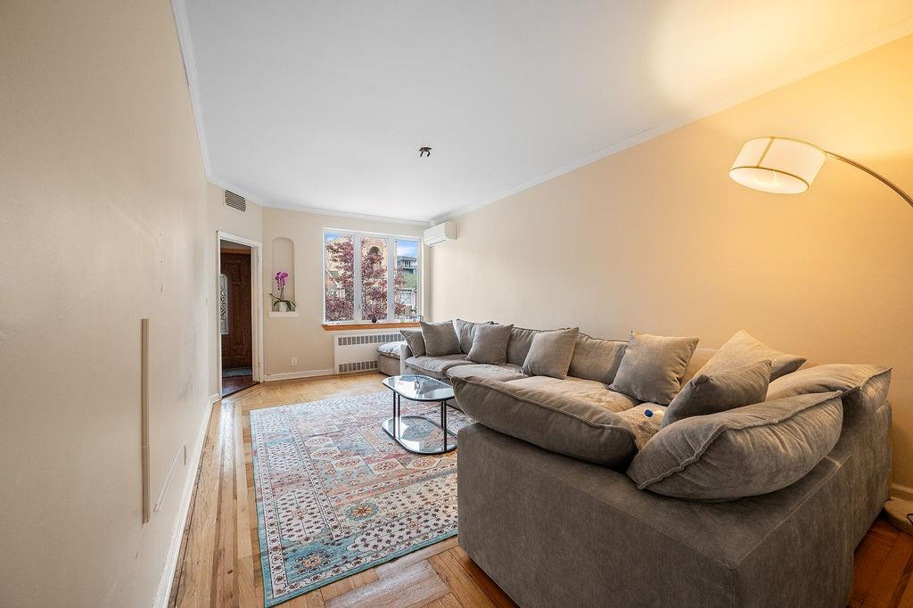 38 Corbin Place Brooklyn, NY 11235 - Photo 13 of 31 a living room with furniture and a rug
