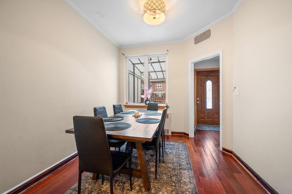 38 Corbin Place Brooklyn, NY 11235 - Photo 15 of 31 a view of a dining room with furniture window and wooden floor