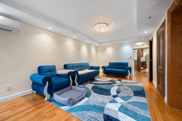 a living room with furniture and a rug