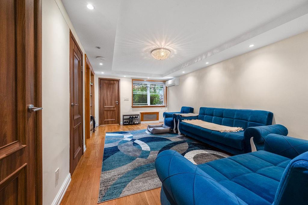 38 Corbin Place Brooklyn, NY 11235 - Photo 9 of 31 a living room with furniture and a window